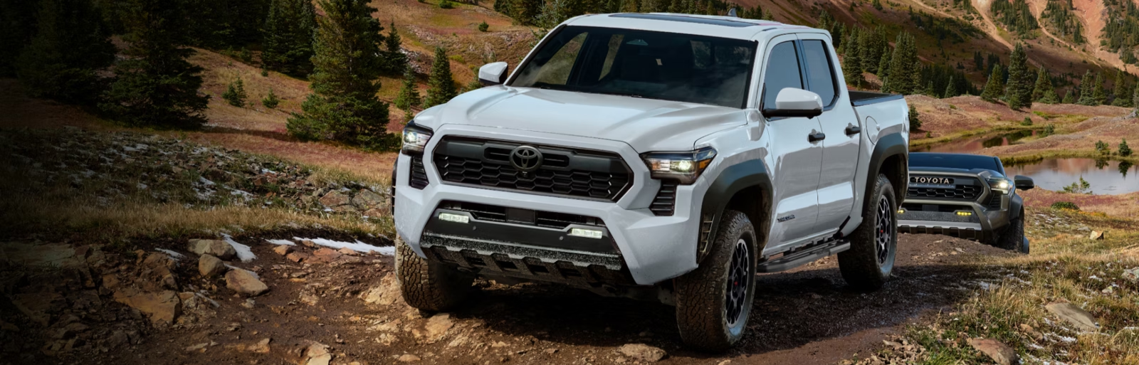 2026 Toyota Tacoma driving on rocky terrain