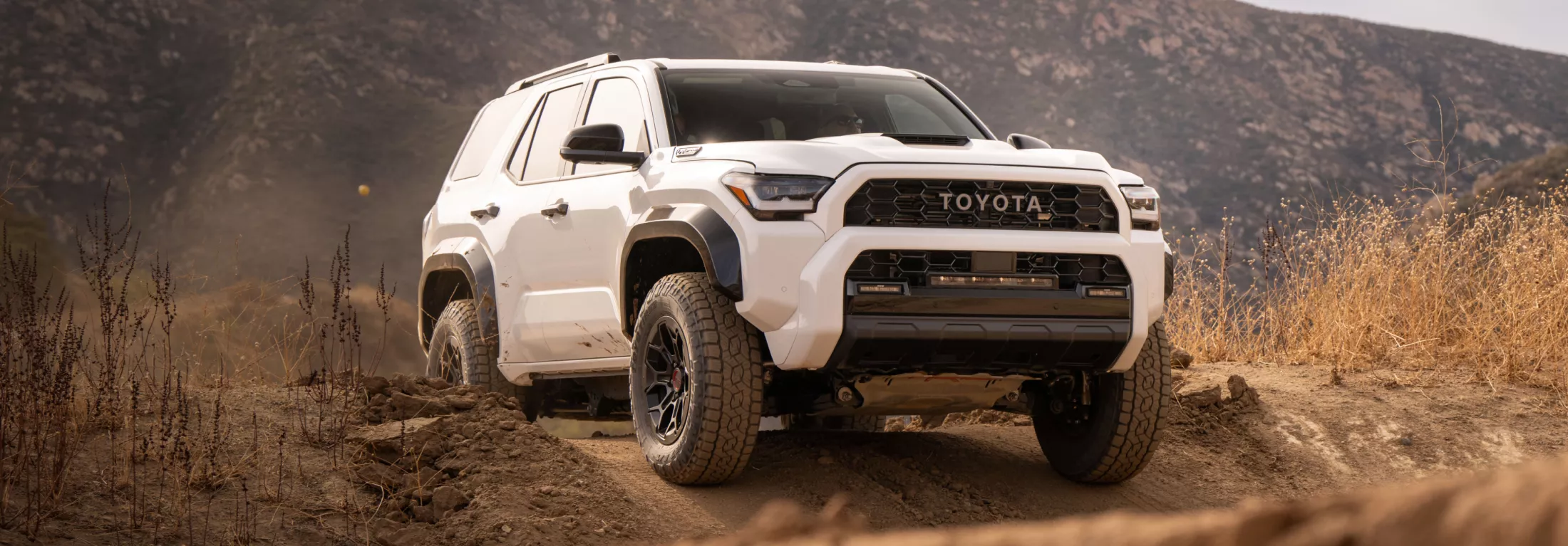 2026 Toyota 4Runner driving through dirt terrain