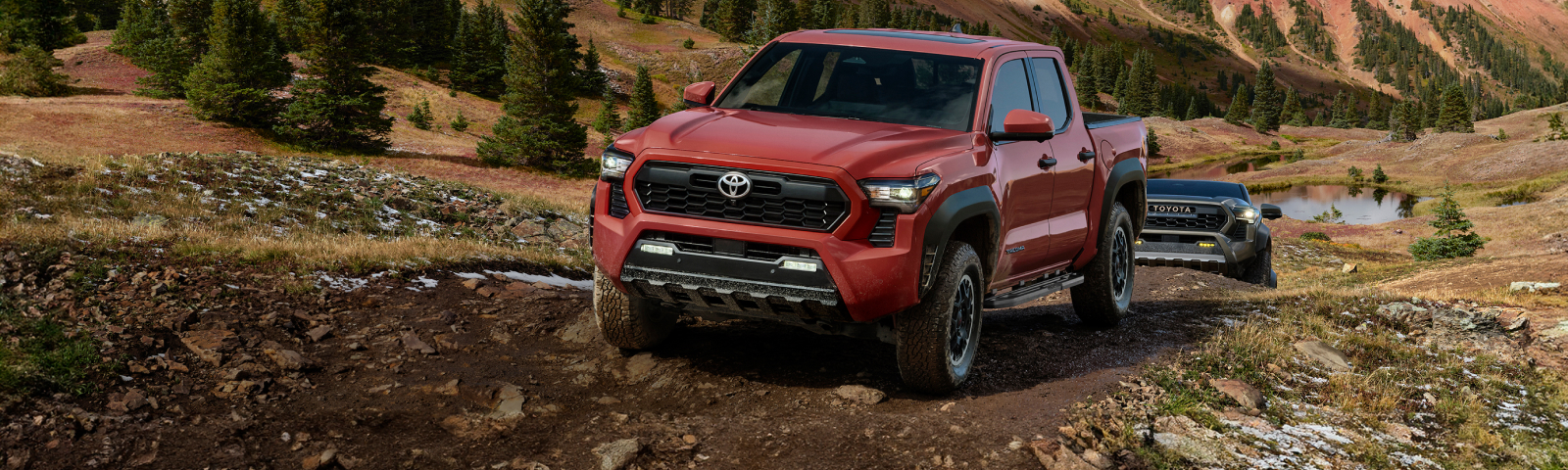 2026 Toyota Tacoma Hybrid driving on rough terrain