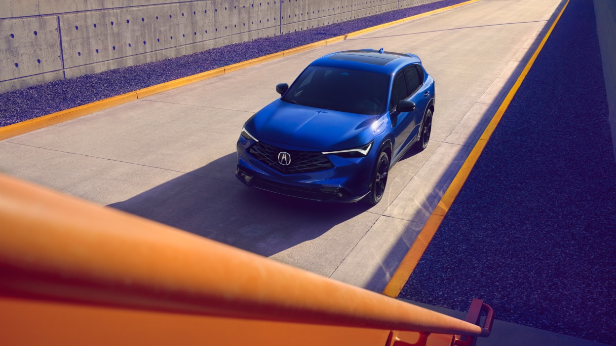 2025 Acura ADX driving on road.