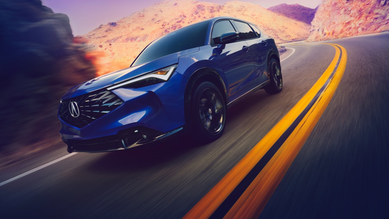 2025 Acura ADX driving on road.
