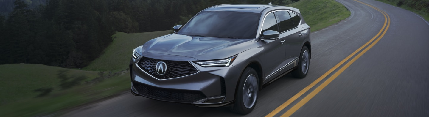 2026 Acura MDX driving down road