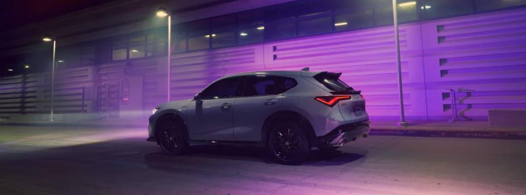 2025 Acura ADX driving down street at night