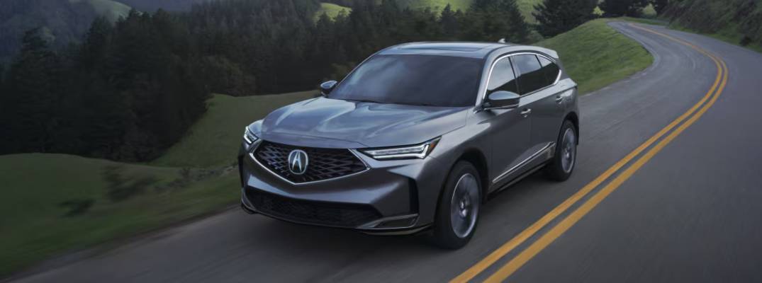 2026 Acura MDX driving down road