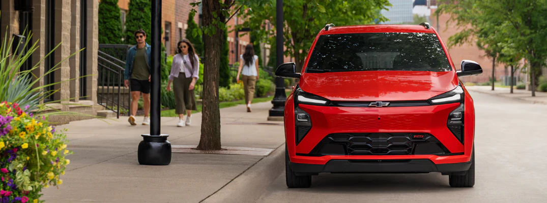 2027 Chevrolet Bolt EV parked by the sidewalk