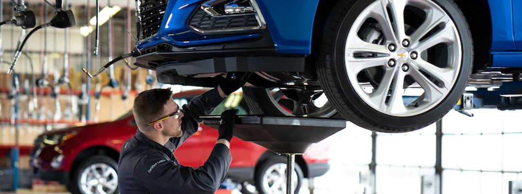 Mechanic underneath a car