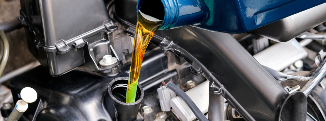 Pouring fluid into the engine bay