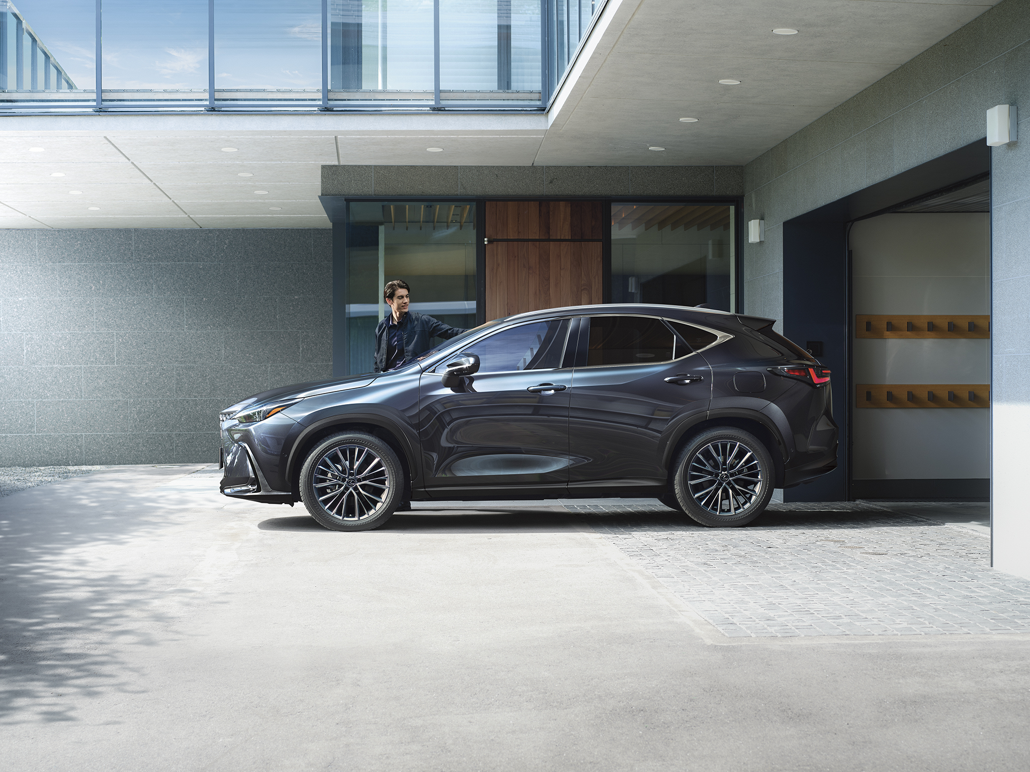 2026 Lexus NX exterior parked in a modern setting — available at Tony Graham Lexus Ottawa