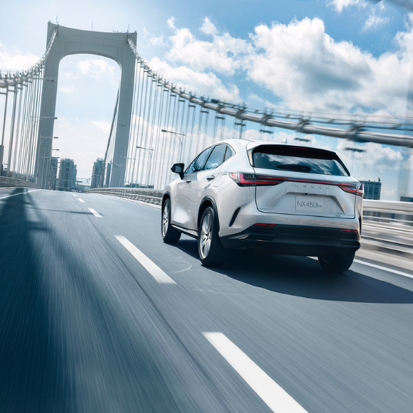 2026 Lexus NX 450h+ Plug-In Hybrid driving on suspension bridge