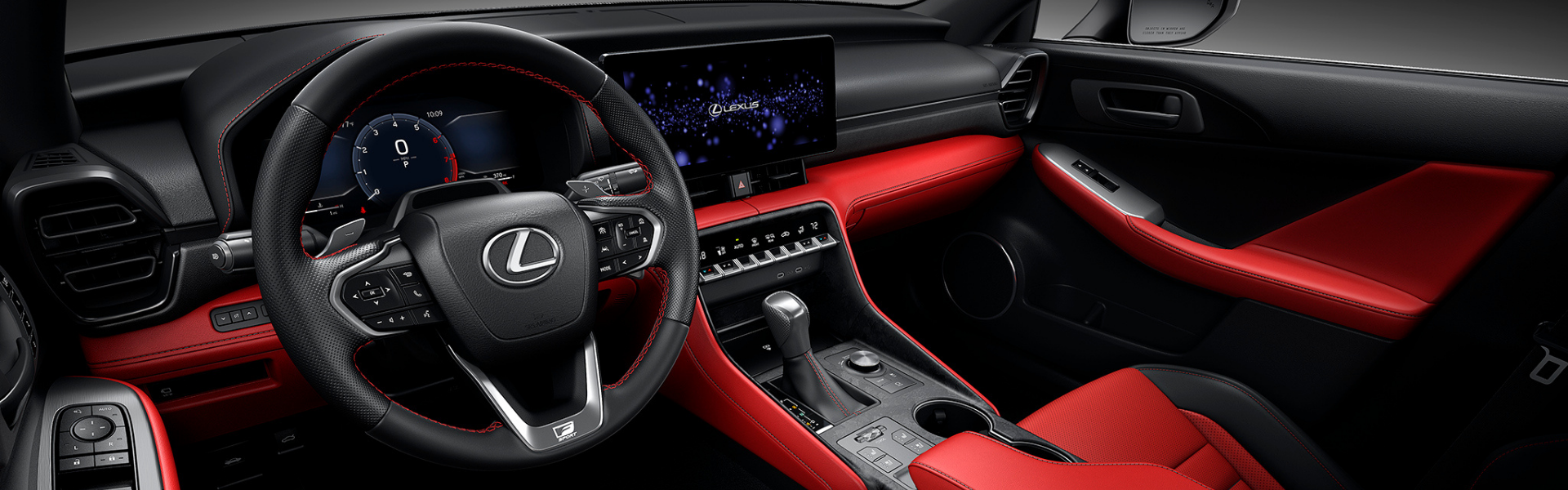 2026 Lexus IS F SPORT interior with red and black leather seats, steering wheel, and dashboard