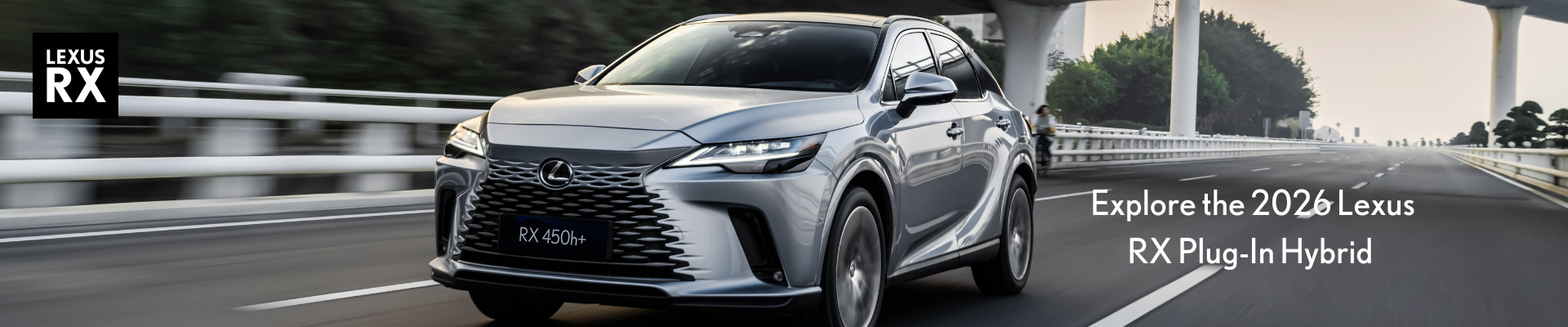2026 Lexus RX Plug-In Hybrid luxury SUV driving on bridge at Tony Graham Lexus in Ottawa