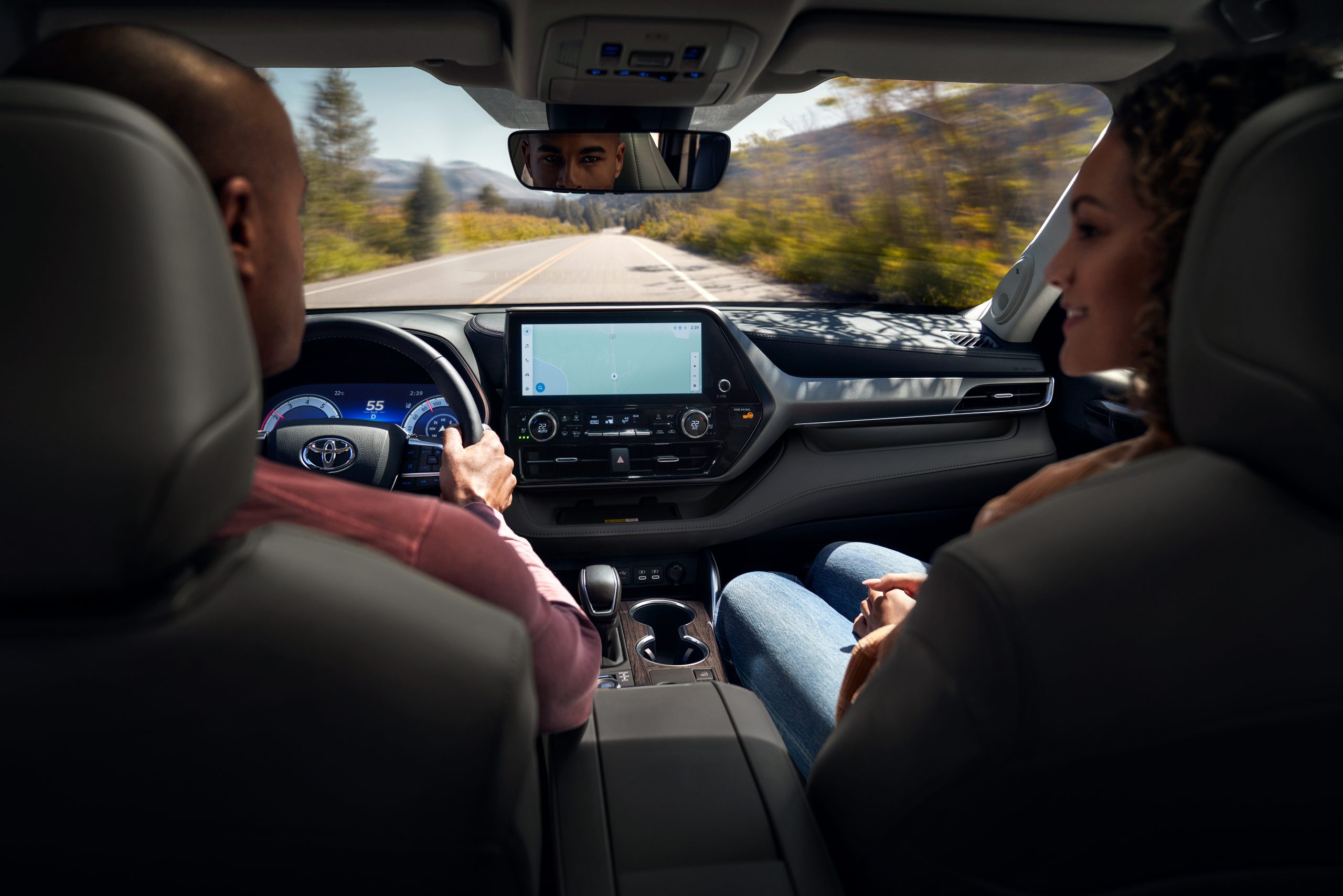 2026 Toyota Highlander Limited interior featuring black leather seats, digital display, and Toyota Multimedia touchscreen with navigation.