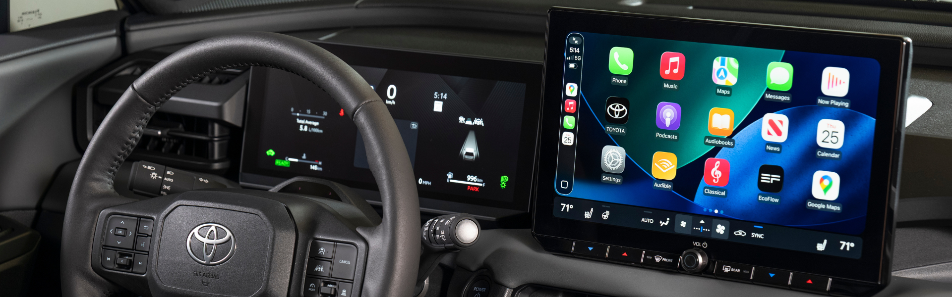 Interior view of a Toyota RAV4 dashboard with steering wheel and touchscreen display