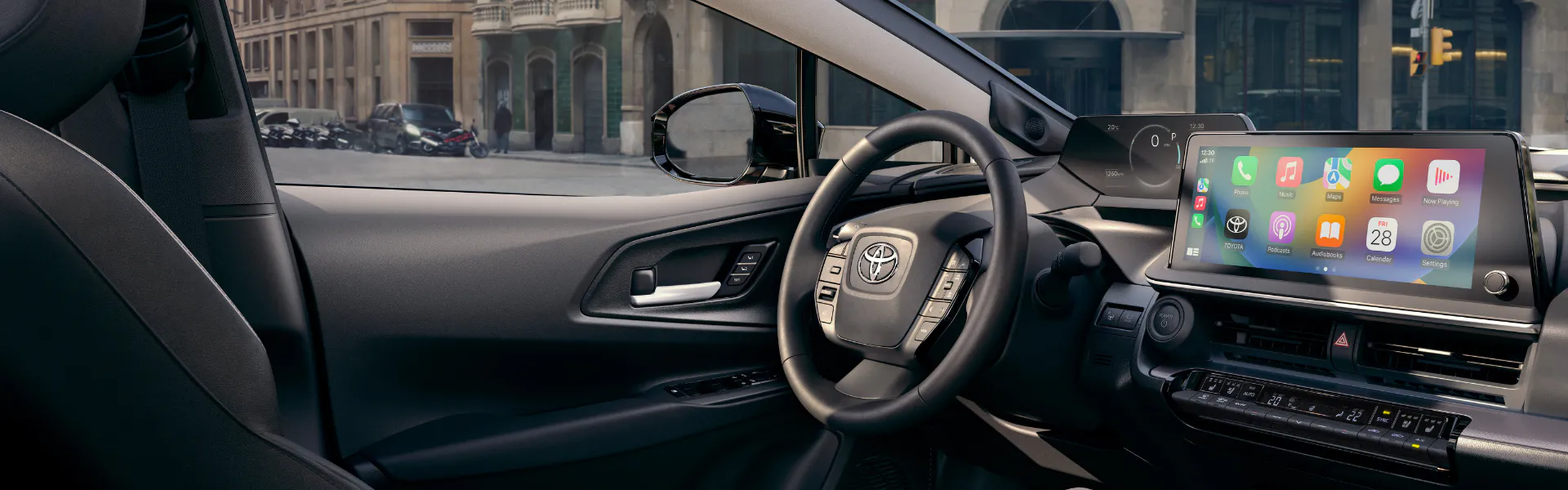 Toyota Prius interior with digital display and Apple CarPlay touchscreen