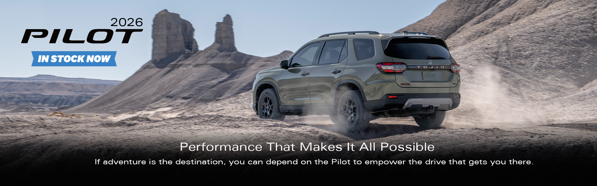 2026 Honda Pilot driving through a desert landscape, available at Village Honda in Calgary.