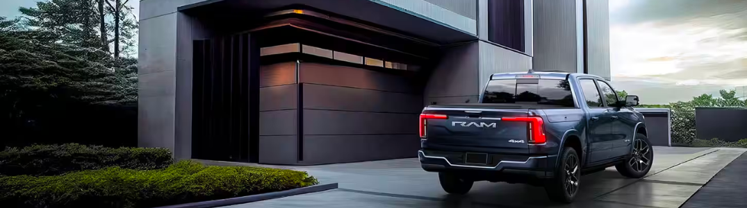 2023 Ram 1500 REV parked in front of a building