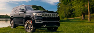 2023 Jeep Grand Wagoneer parked in a field