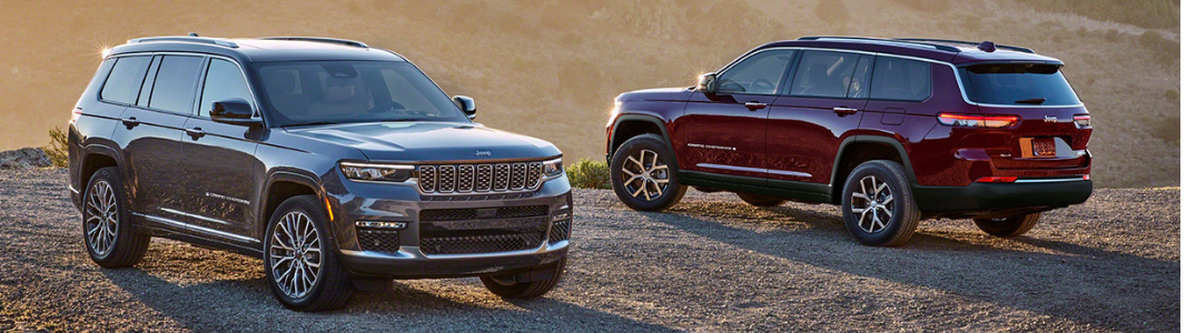 Two 2024 Jeep Grand Cherokee models parked off-road