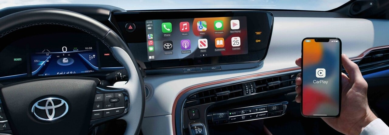 Person holding phone to set up Toyota Connected Services