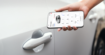 Person using digital key on toyota vehicle.