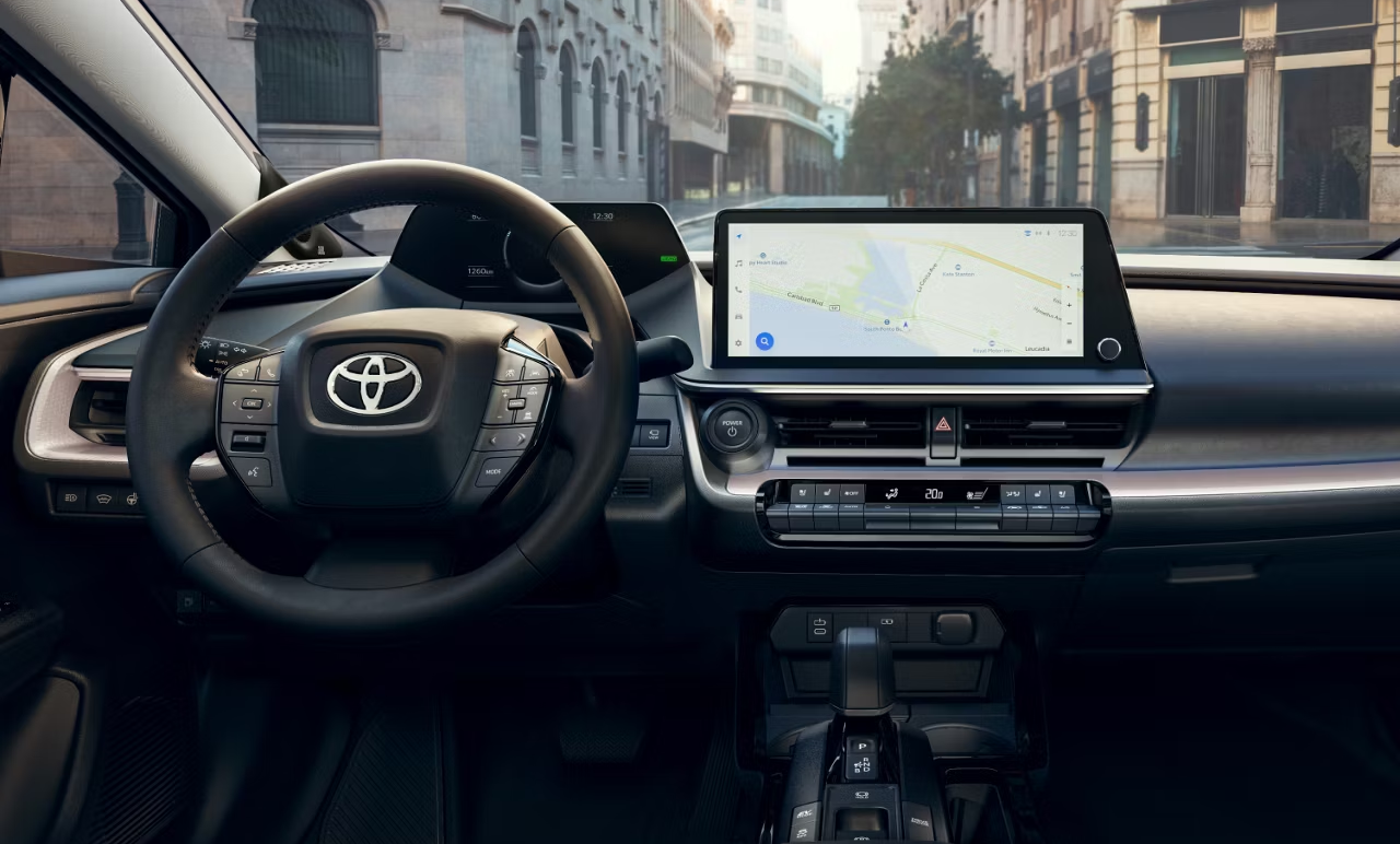 Steering wheel and navigational map inside unknown Toyota vehicle.
