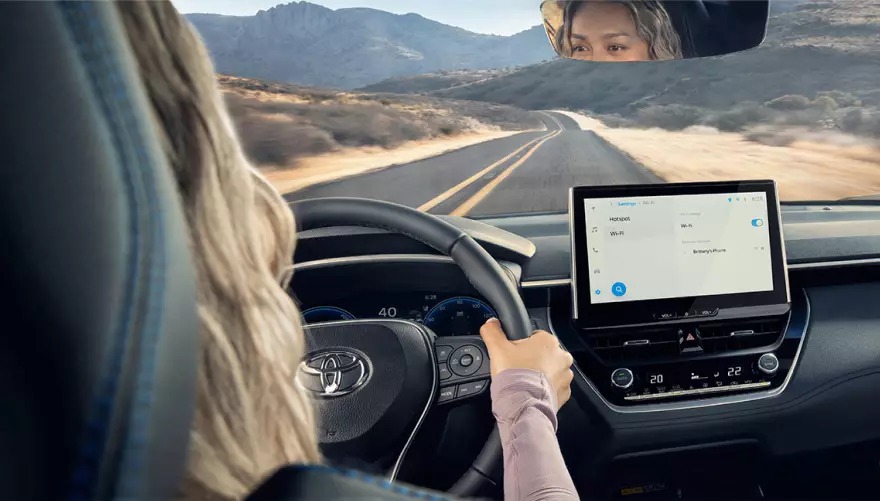 Person driving 2026 Toyota Corolla Cross