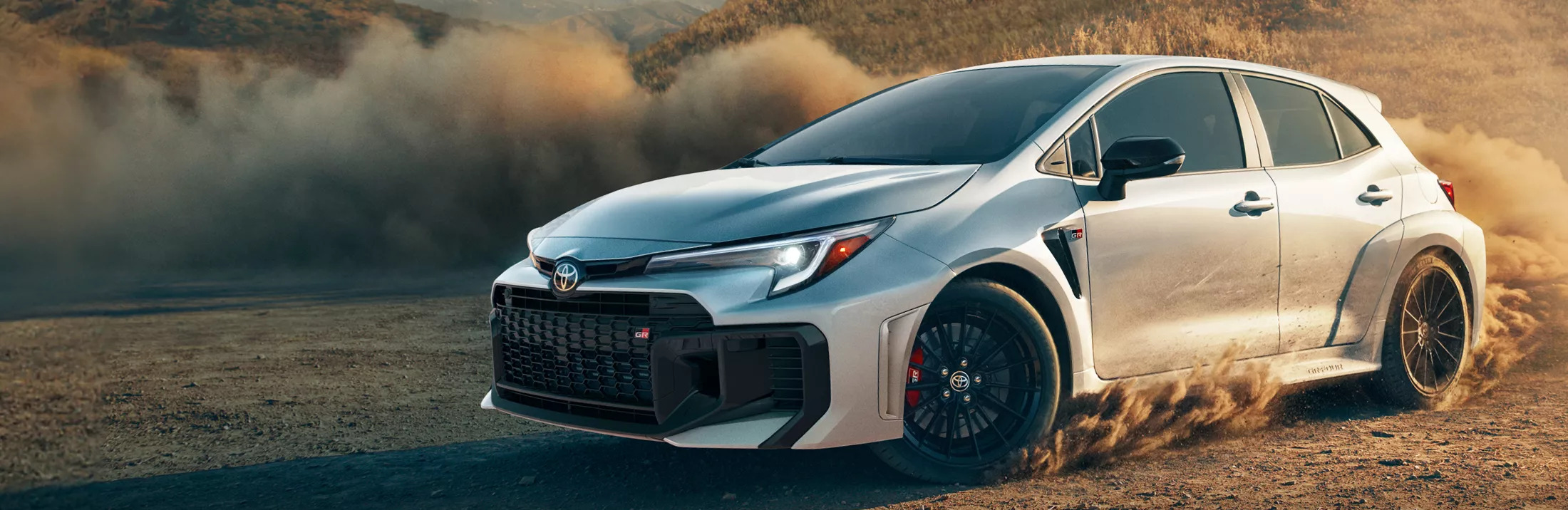 2026 Toyota GR Corolla driving through dust