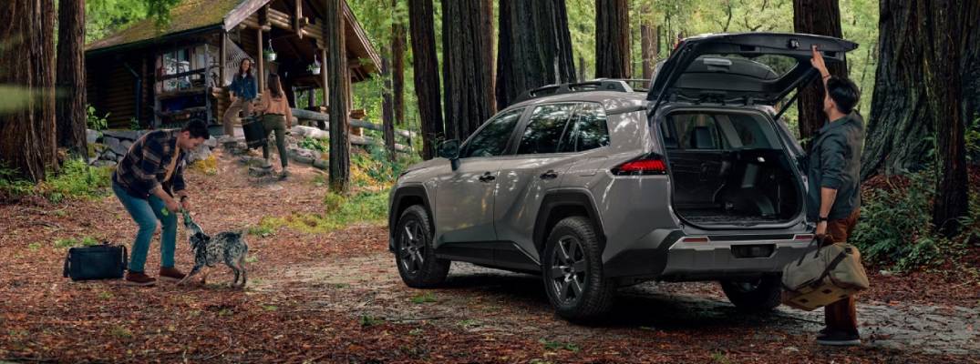 People standing near 2026 rav4 woodland with trunk open