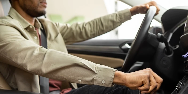 A man test drives a used vehicle.