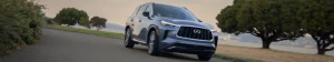 2025 INFINITI QX60 on open road.