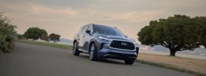 2025 QX60 driving on road.