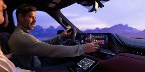 Person using multimedia screen inside 2026 INFINITI QX80