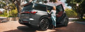 Woman exiting 2026 INFINITI QX80