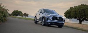 2025 INFINITI QX60 driving down road