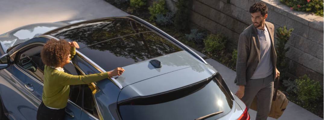 Unknown people standing on either side of 2025 QX50