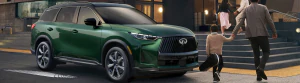 2026 INFINITI QX60 parked near building with people walking around