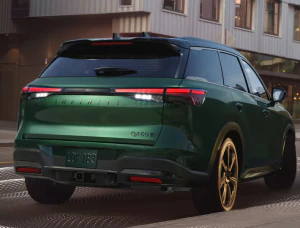 Rear shot of 2026 INFINITI QX60 driving down road
