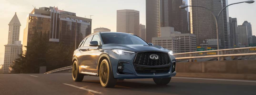QX50 driving down city street.