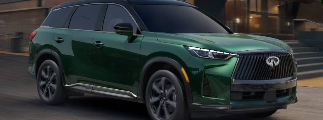 2026 INFINITI QX60 driving down road