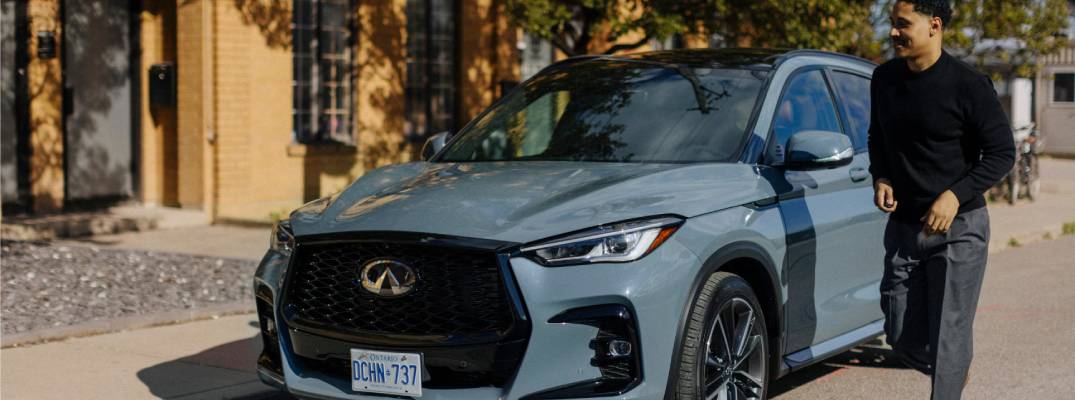 Unknown person walking next to 2025 INFINITI QX50