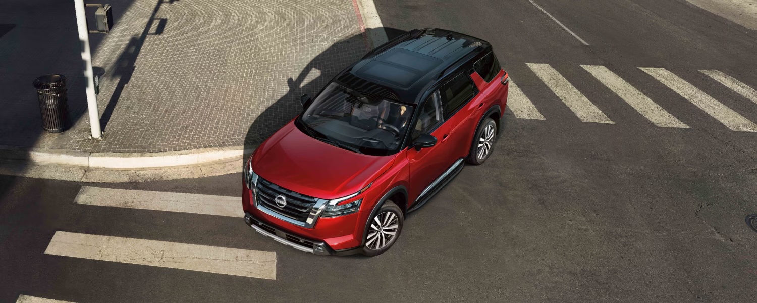 Nissan Pathfinder turning a corner during daytime