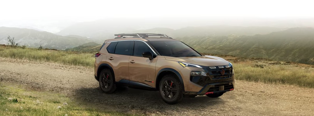 2026 Nissan Rogue Rock Creek Edition driving on muddy pathway