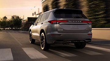 2026 Nissan Rogue PHEV driving down street