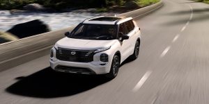 2026 Nissan Rogue PHEV driving down road