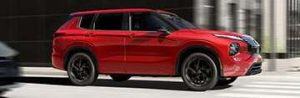 2026 Nissan Rogue PHEV driving down street