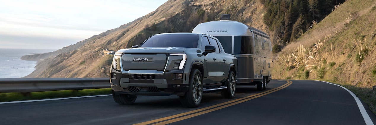 2025 GMC Sierra EV Denali pulling a trailer