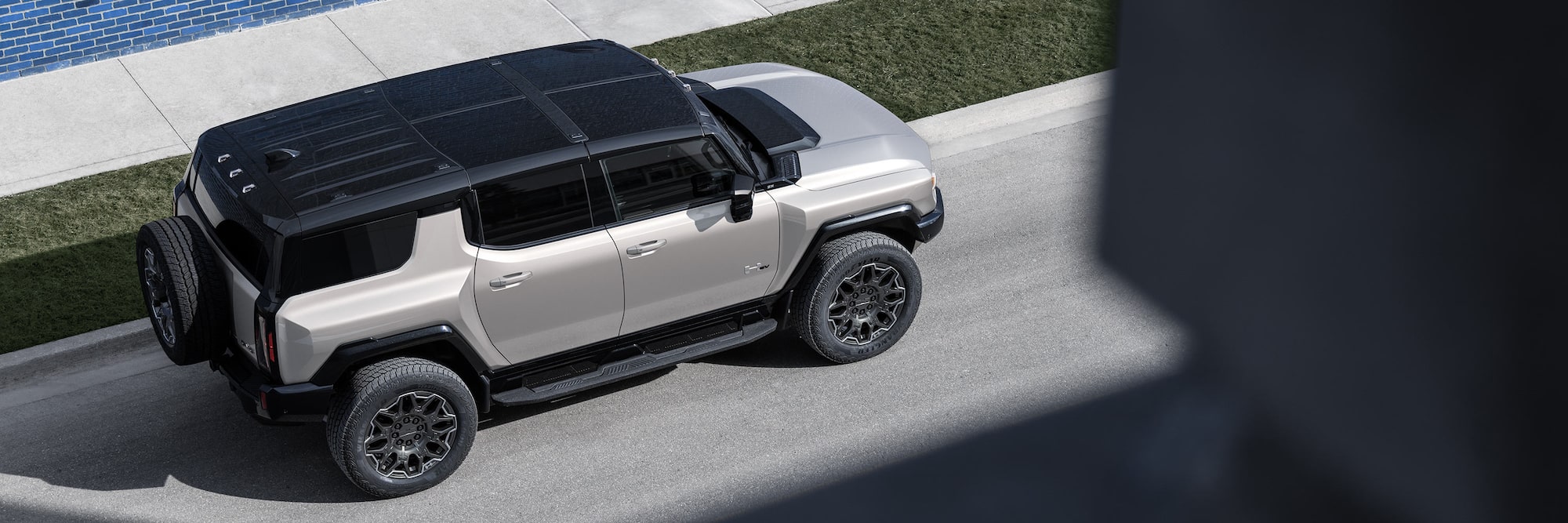 2026 GMC Hummer EV SUV driving on road