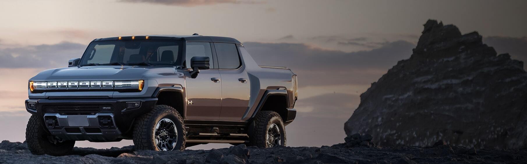 2026 GMC Hummer EV Pickup Truck on rocky terrain