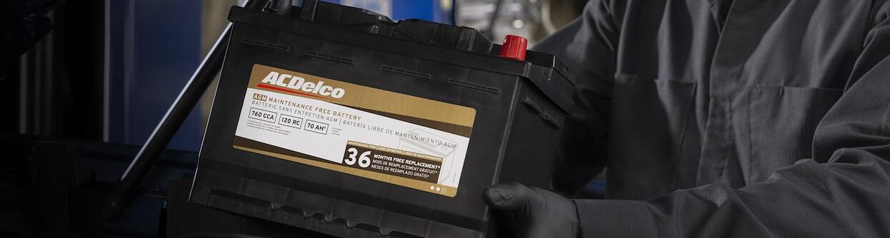 technician holding battery