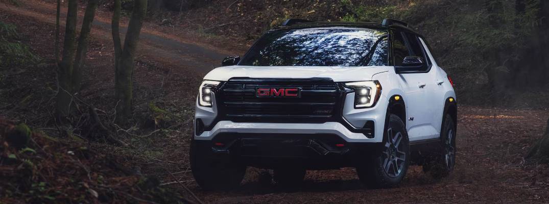 2026 GMC Terrain driving down pathway